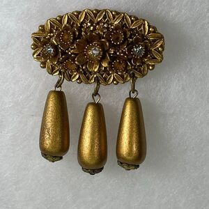 Vintage celluloid float dangle gold tone brooch
